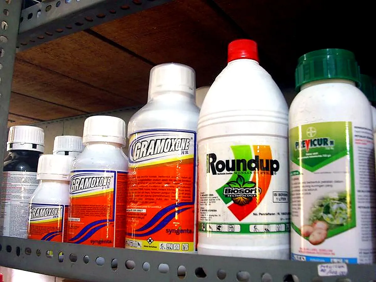 Herbicide and agrochemical bottles on a shelf